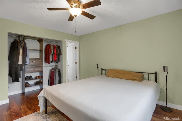 1010 Vondelpark Dr, Colorado Springs, CO 80907 - bedroom with a closet, wood finished floors, ceiling fan, and a textured ceiling