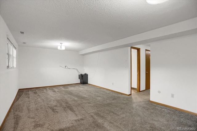 1010 Vondelpark Dr, Colorado Springs, CO 80907 - below grade area featuring carpet flooring and a textured ceiling