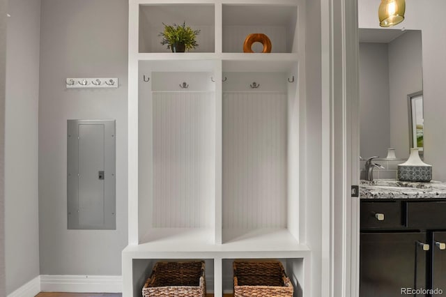 mudroom featuring electric panel and sink