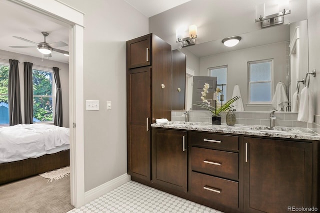 bathroom with ceiling fan and vanity