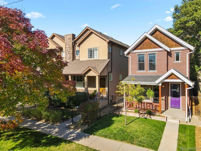 view of front of house featuring a front yard and covered porch