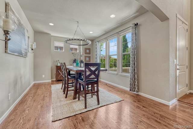 15235 W Iliff Ave, Lakewood, CO 80228 - dining room featuring wood finished floors, baseboards, recessed lighting, and a chandelier