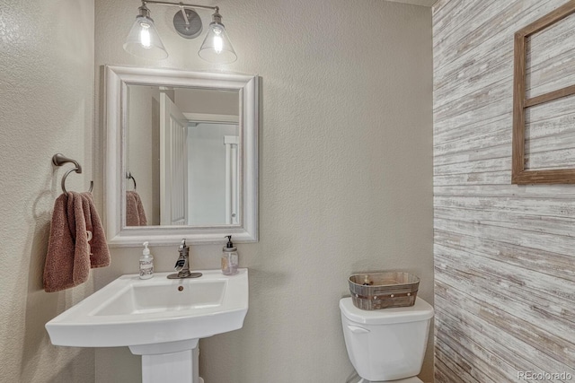 15235 W Iliff Ave, Lakewood, CO 80228 - bathroom with toilet and a textured wall