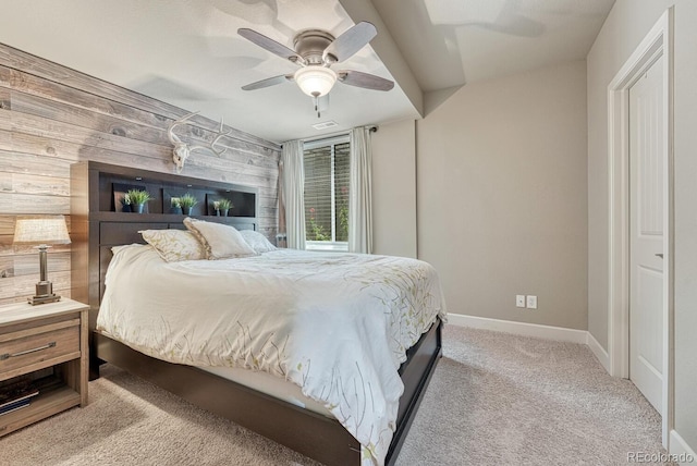 15235 W Iliff Ave, Lakewood, CO 80228 - carpeted bedroom featuring baseboards, a ceiling fan, and wooden walls