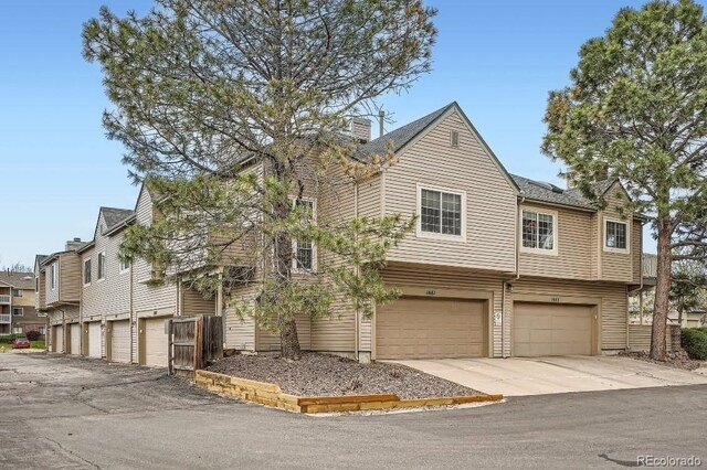 1661 S Fulton St, Aurora, CO 80247 - multi unit property with an attached garage and concrete driveway