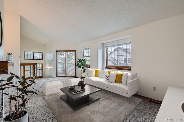 1661 S Fulton St, Aurora, CO 80247 - carpeted living room with healthy amount of natural light, a textured ceiling, baseboards, and lofted ceiling