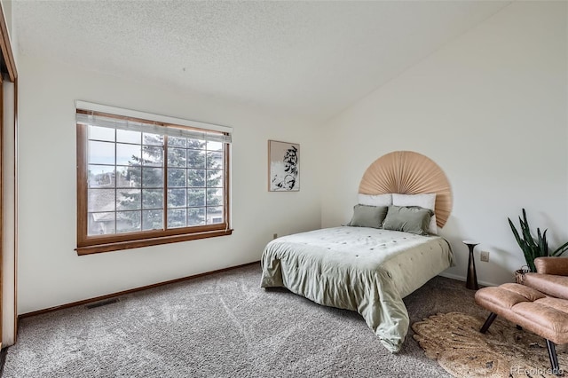 1661 S Fulton St, Aurora, CO 80247 - carpeted bedroom with lofted ceiling, a textured ceiling, and baseboards