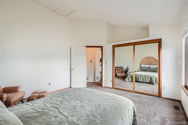1661 S Fulton St, Aurora, CO 80247 - carpeted bedroom featuring lofted ceiling, attic access, baseboards, and a closet