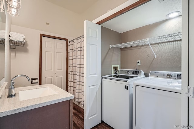 1661 S Fulton St, Aurora, CO 80247 - laundry room featuring washer and dryer and dark wood-style flooring