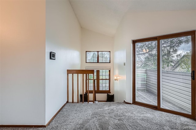 1661 S Fulton St, Aurora, CO 80247 - empty room featuring carpet flooring, vaulted ceiling, and baseboards