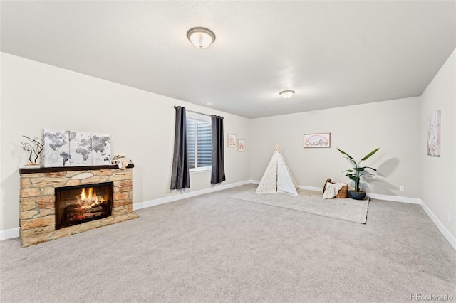 game room featuring carpet floors and a fireplace