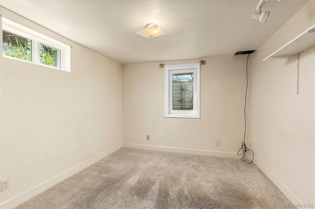430 S Potomac Cir, Aurora, CO 80012 - basement with plenty of natural light, carpet flooring, and baseboards