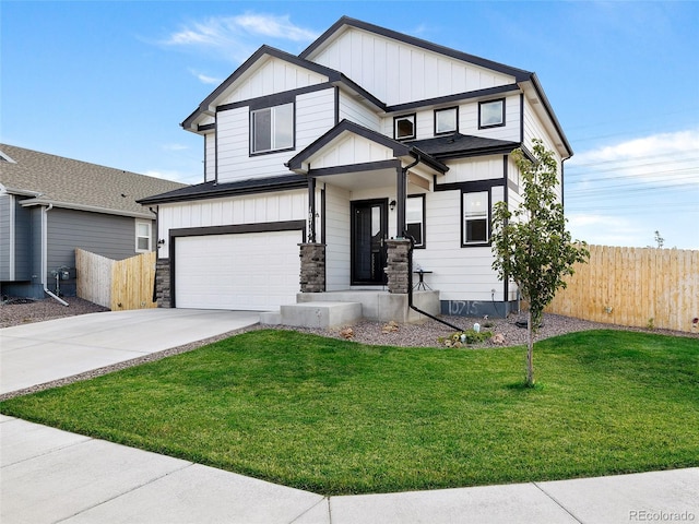 view of front of home with a garage and a front lawn