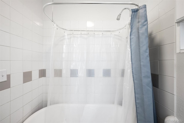 215 E 11th Ave Unit D5, Denver, CO 80203 - bathroom featuring shower / bathtub combination with curtain