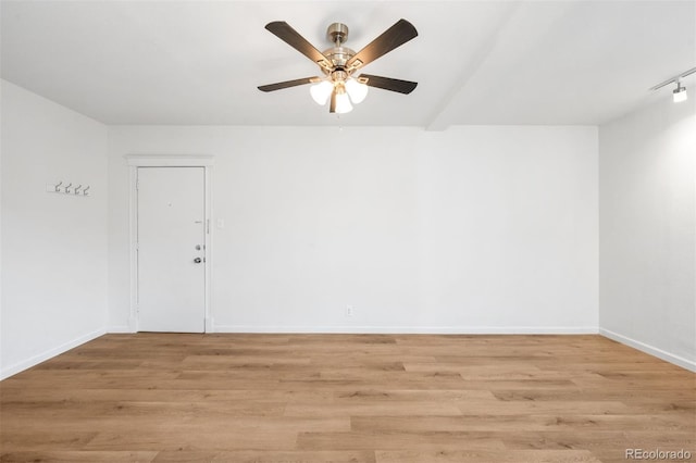 215 E 11th Ave Unit D5, Denver, CO 80203 - empty room featuring ceiling fan, light wood finished floors, and baseboards