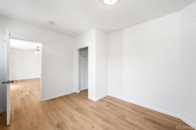 215 E 11th Ave Unit D5, Denver, CO 80203 - unfurnished bedroom with light wood-style floors, baseboards, and a closet