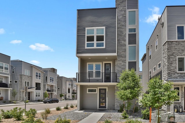 20999 E Quincy Dr, Aurora, CO 80015 - contemporary home with a balcony and a residential view