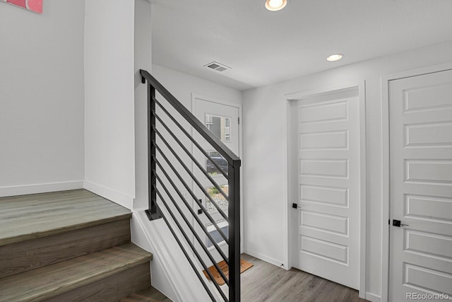 20999 E Quincy Dr, Aurora, CO 80015 - stairs with wood finished floors, baseboards, and recessed lighting