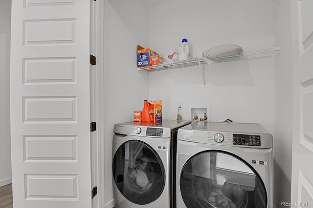 20999 E Quincy Dr, Aurora, CO 80015 - laundry area with separate washer and dryer and wood finished floors