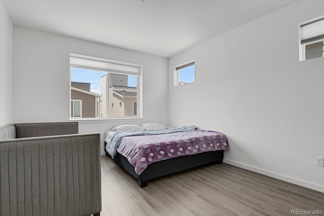 20999 E Quincy Dr, Aurora, CO 80015 - bedroom featuring wood finished floors and baseboards