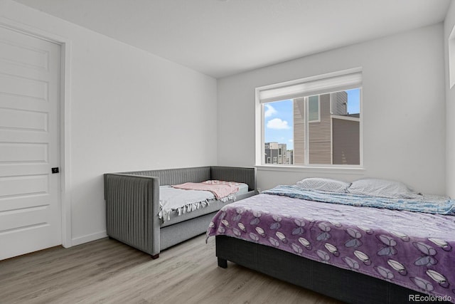 20999 E Quincy Dr, Aurora, CO 80015 - bedroom featuring wood finished floors and baseboards
