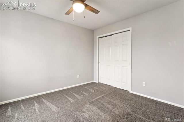 unfurnished bedroom with ceiling fan, carpet floors, and a closet