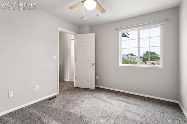 unfurnished bedroom with carpet floors and ceiling fan