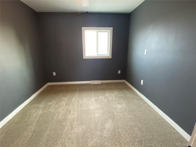 spare room featuring carpet flooring