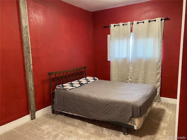 bedroom featuring carpet