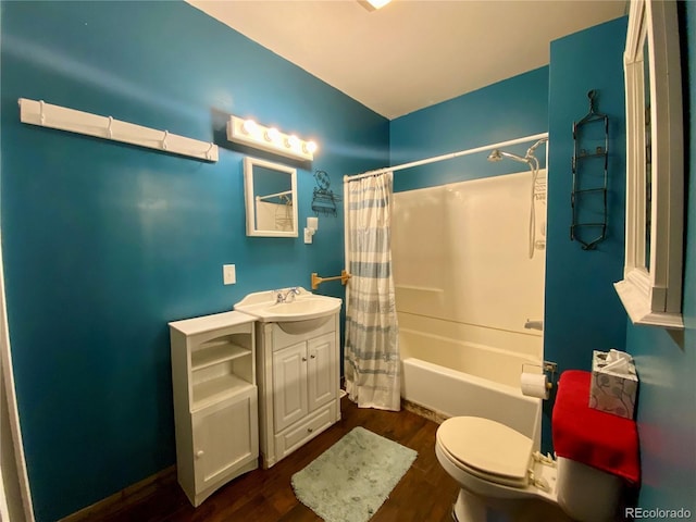 full bathroom with vanity, wood-type flooring, shower / bath combo, and toilet