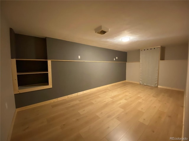 basement with light wood-type flooring