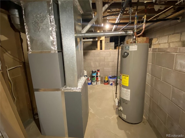 utility room featuring heating unit and gas water heater