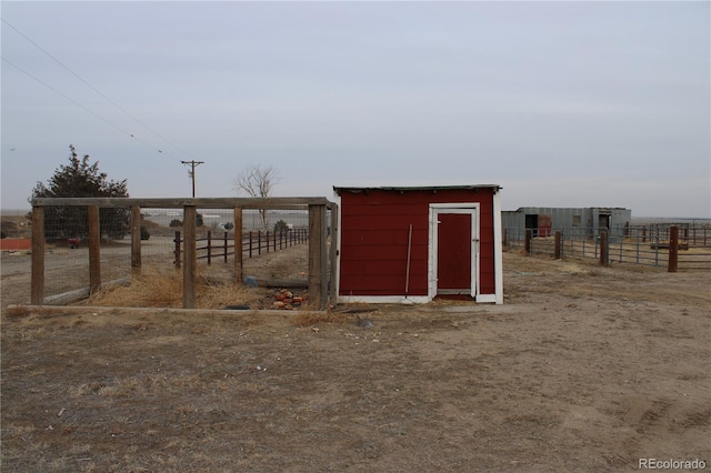 view of outdoor structure featuring a rural view