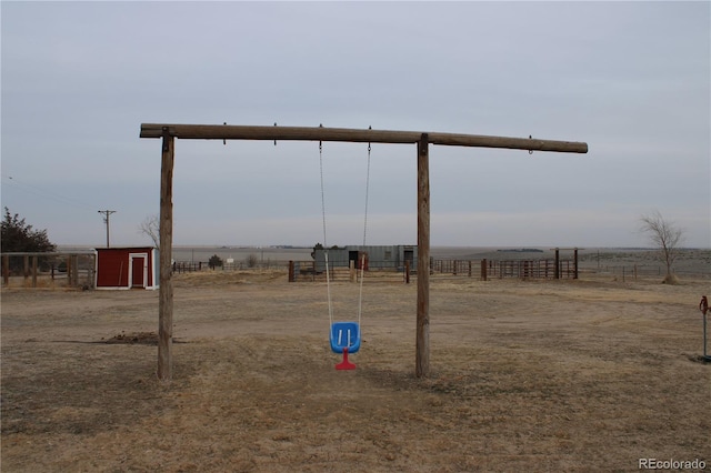 view of yard with a rural view