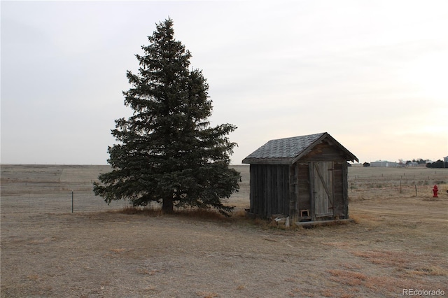 view of outbuilding with a rural view