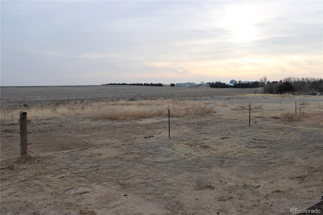 yard at dusk with a rural view