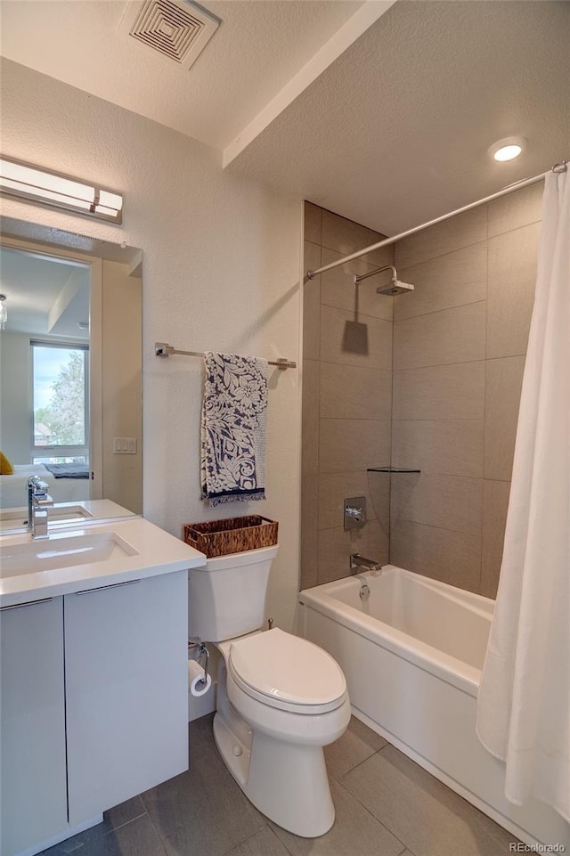 5125 W 29th Ave Unit 1, Denver, CO 80212 - full bath with shower / bathtub combination with curtain, toilet, vanity, a textured ceiling, and tile patterned floors