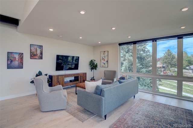 5125 W 29th Ave Unit 1, Denver, CO 80212 - living room with light wood finished floors, recessed lighting, and baseboards