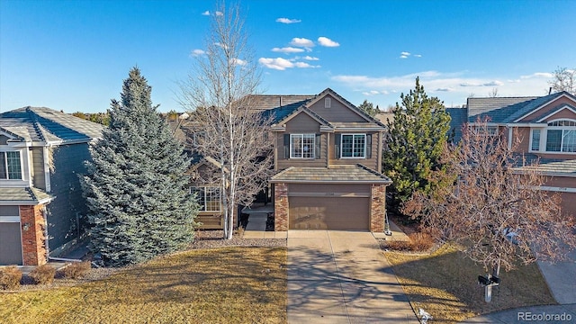 view of front facade featuring driveway, an attached garage, and brick siding