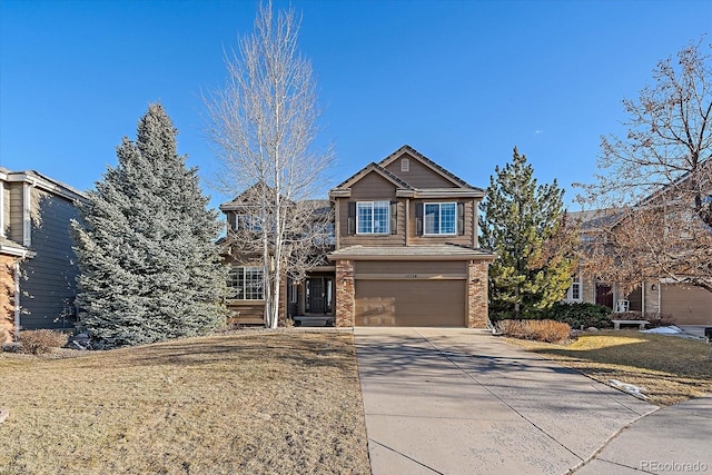 view of front of house featuring driveway, brick siding, a front lawn, and an attached garage