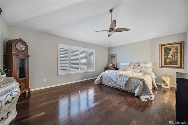 bedroom featuring hardwood / wood-style flooring, ceiling fan, and baseboards