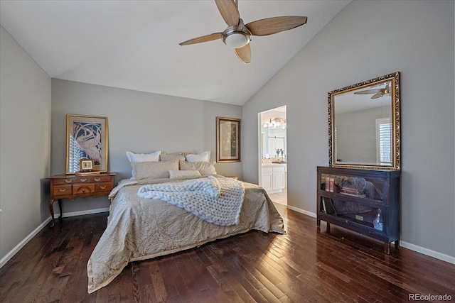 bedroom featuring vaulted ceiling, ensuite bath, wood finished floors, and baseboards