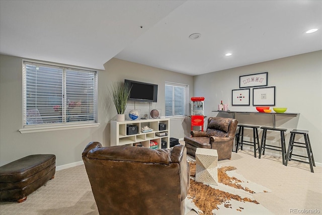 carpeted living room featuring recessed lighting and baseboards