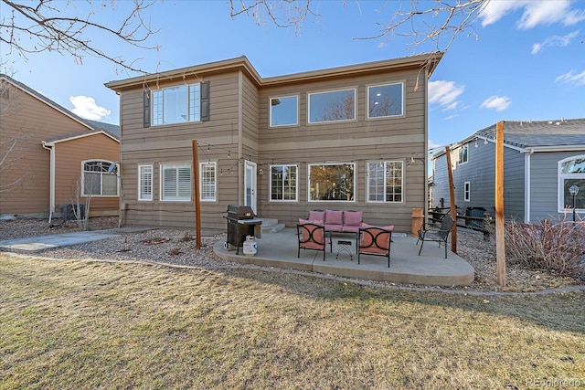 rear view of property featuring an outdoor hangout area, a lawn, and a patio area