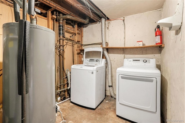 laundry area with laundry area, gas water heater, and washer and dryer