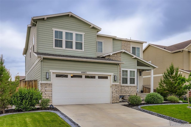 6883 E 132nd Pl, Thornton, CO 80602 - view of front of property with stone siding, an attached garage, and concrete driveway