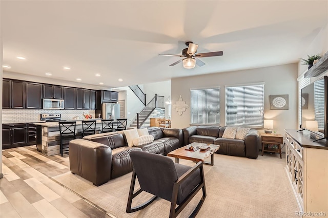 6883 E 132nd Pl, Thornton, CO 80602 - living room with stairs, a ceiling fan, and recessed lighting