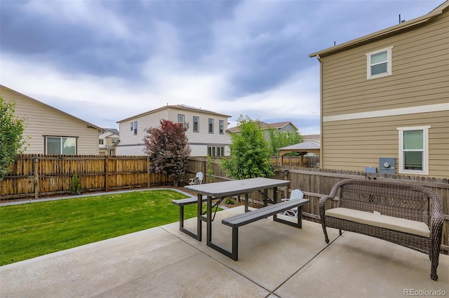 6883 E 132nd Pl, Thornton, CO 80602 - fenced backyard featuring outdoor dining space and a patio