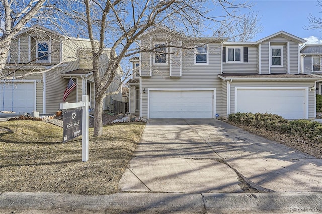 view of front of property featuring a garage and concrete driveway