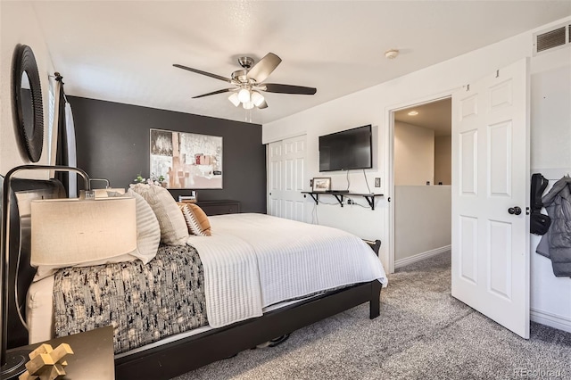 bedroom with carpet flooring, a ceiling fan, visible vents, baseboards, and a closet